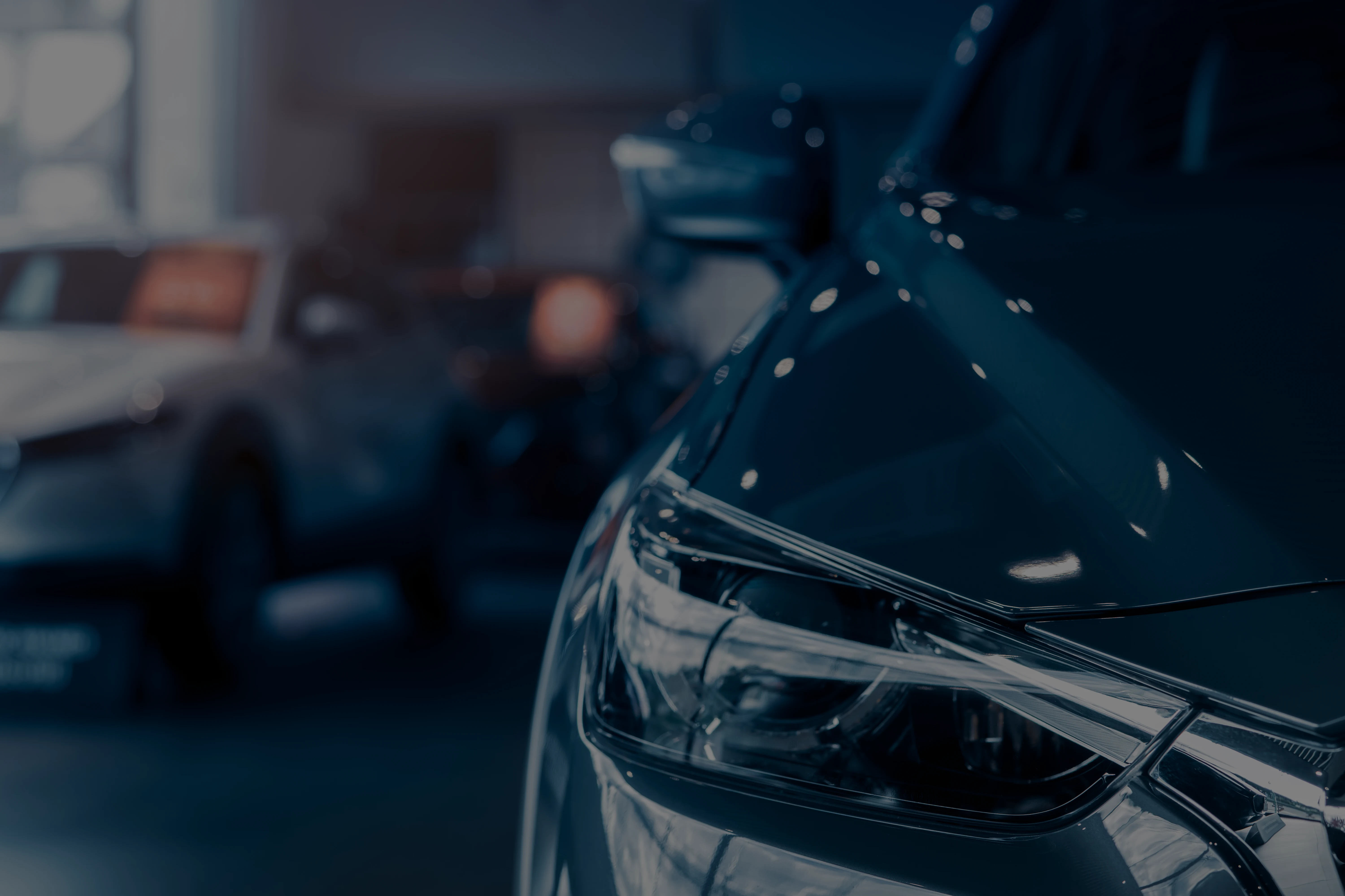 Selective-focus-grey-car-parked-in-luxury-showroom