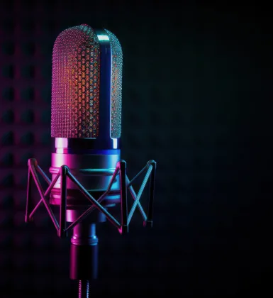 close up on a microphone on a purple hue