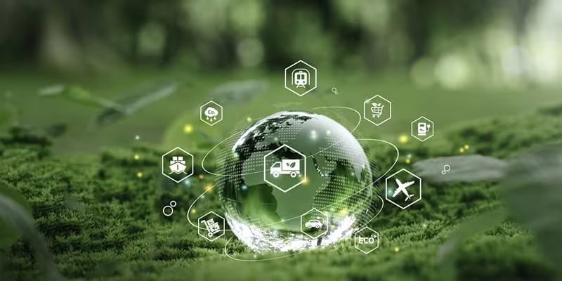 Glass globe in the moss on the forest floor surrounded by white icons relating tot he environment