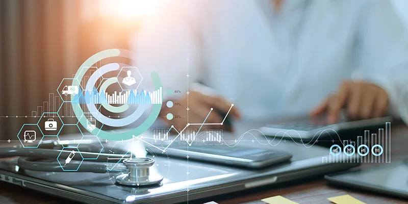 Hands of doctor doing finances and calculate on table and Healthcare business graph data and growth on hospital background.