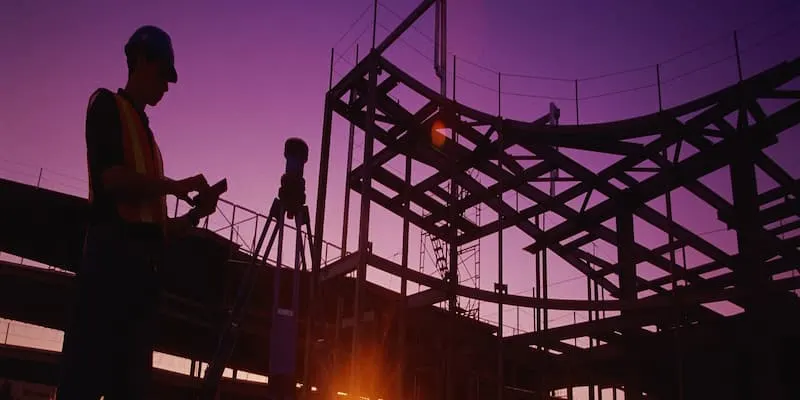 Purple sunset with construction work silhouette
