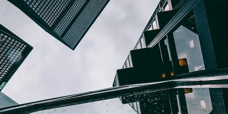 Ants eye view of skyscrapers on a grey sky
