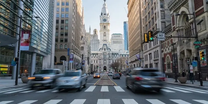 Busy street with blurry cars and crosswalk